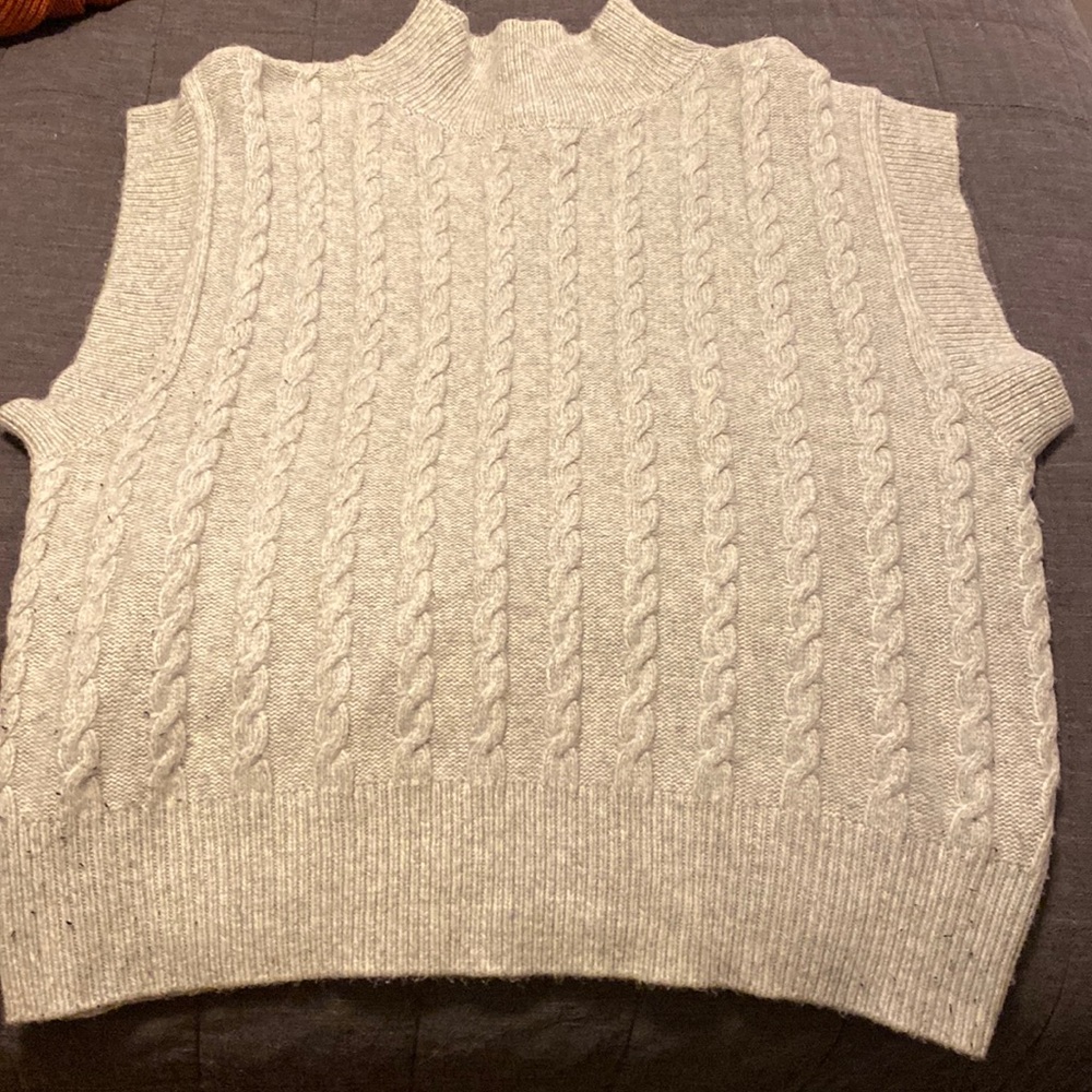 Sleeveless mock neck sweater